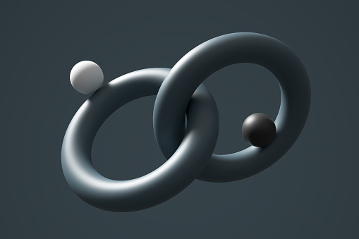 Unity or integration concept. Balance, harmony, stability and equilibrium. Two spheres balancing on interlocked circles. 3D render.