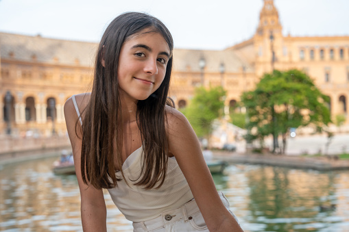 A young girl enjoys outdoor time in Plaza de Espana, Sevilla - Spain