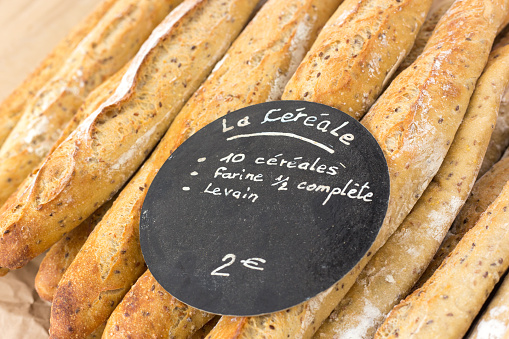 Lyon, France: Fresh Wholegrain Baguettes Close-Up With Sign