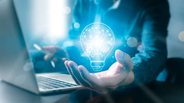 Businessman's hand is holding a lit lightbulb with a network connection line, representing the concepts of inspiration and creativity. idea innovation using glittery lightbulbs. Businessman's hand is holding a lit lightbulb with a network connection line, representing the concepts of inspiration and creativity. idea innovation using glittery lightbulbs. global patent stock pictures, royalty-free photos & images