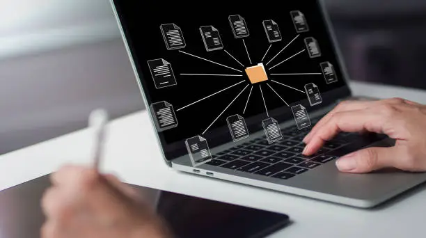 Photo of Conceptualization of a document management system with a businesswoman holding a folder and a document icon. Searching and managing files in an online document database.