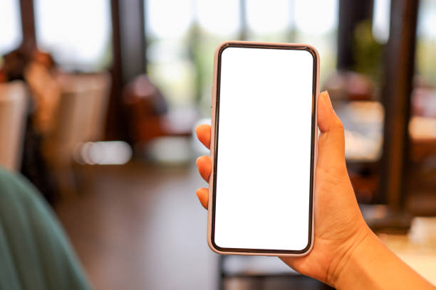 istock Women's hands holding cell telephone blank copy space screen. smartphone with blank white screen isolated on white background . smart phone with technology concept 1488168252