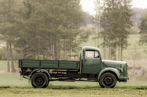 Classic oldtimer vintage truck on a country road.