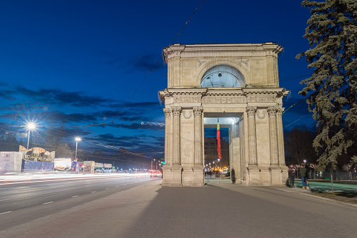 Chisinau, Moldova - March 8, 2023: Night view on Triumphal arch (Arcul de triumf) in Chisinau. Popular tourist attraction in capital of Moldova.