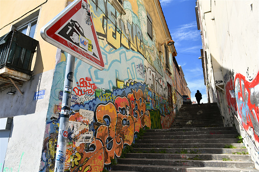 Typical graffiti street scene in Lisbon, Portugal. Photo taken during a warm summer day.