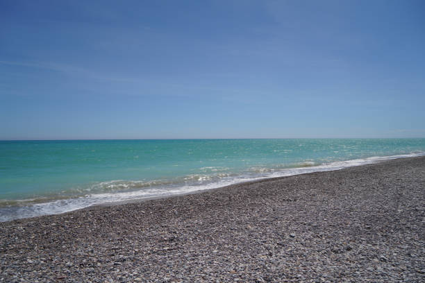 istock waves on mediterranean sea with pebble beach 1488172916