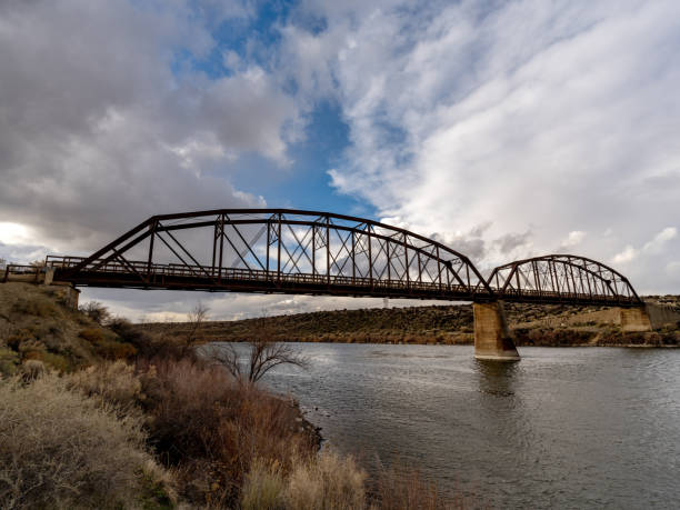 istock Old metal bridge leading over the Snake River in Idaho 1488174630