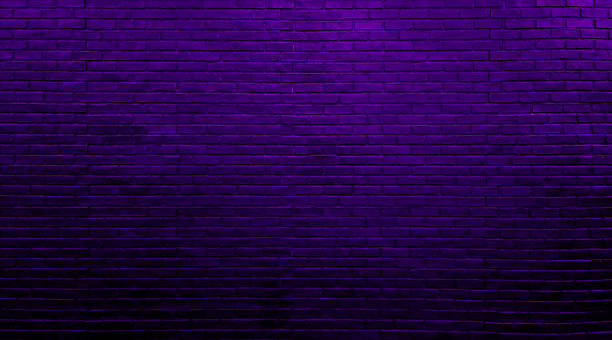 istock neon purple brick wall texture for pattern background. abstract architectural wide panorama brick work wall for rustic, industrial, loft, futuristic design in close up view. 1488184544