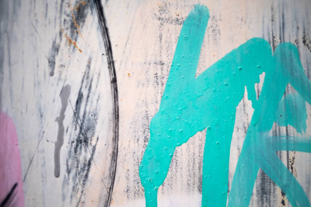 Abstract paint stains on a metal surface, grungy and messy background.
