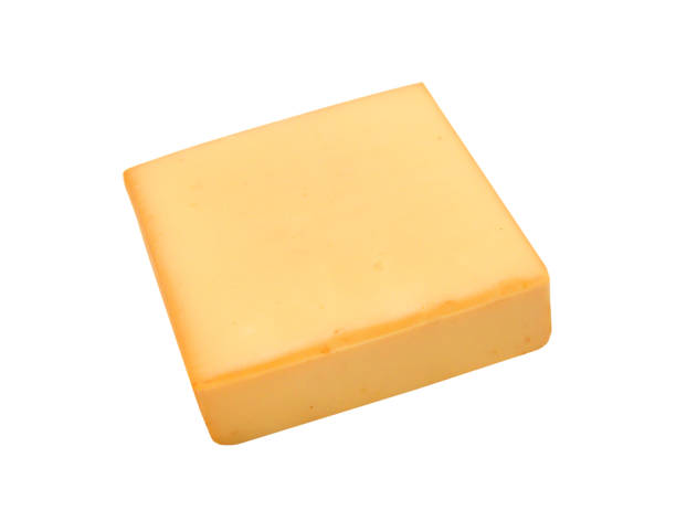 istock Cubes of cheddar cheese isolated on white 1488187008
