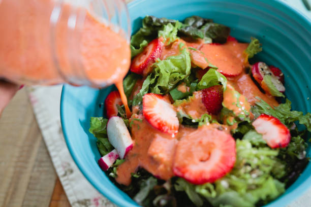 istock Pouring the Strawberry Vinaigrette 1488188443