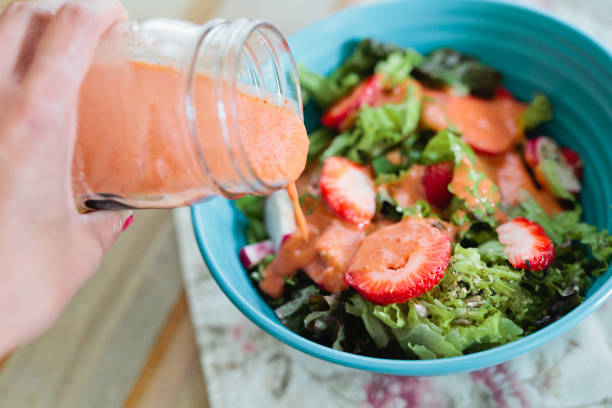 Pouring the Strawberry Vinaigrette