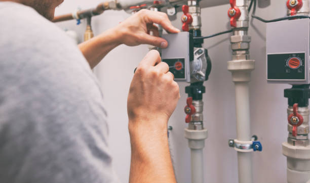 istock The man is installing the heater system in the house 1488188635