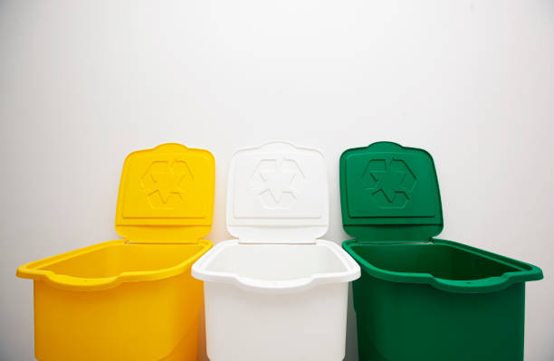 istock Three colorful trash cans for sorting garbage. For plastic, glass and paper 1488188672