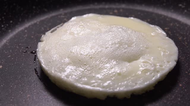 Mold is removed from a protein that is fried in a pan