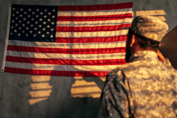 istock Army officer saluting flag. 1488191965