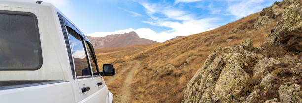 istock SUV stands in a mountainous area 1488194126
