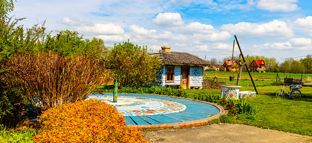 Zalipie, Poland - April 29, 2023: Traditional folk flower painting decorating village aside Dom Malarek House of Painters ethnographic museum in Zalipie village near Tarnow in Lesser Poland