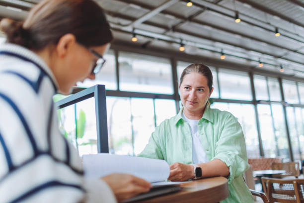 istock A lobby meeting between two women for a job interview 1488207626