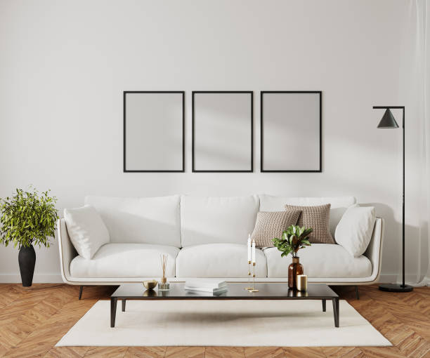 istock Poster frame mock up in modern home living room interior with white sofa and coffee table with decor, 3d render 1488208262