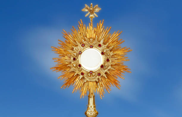 istock ostensory - catholic religious symbol on blue background 1488211184