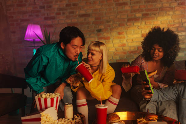 istock Joyful friends drink at party. 1488212511