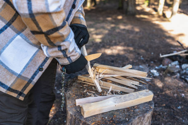 istock Cutting shavings with a bushcraft knife to get a fire 1488215890