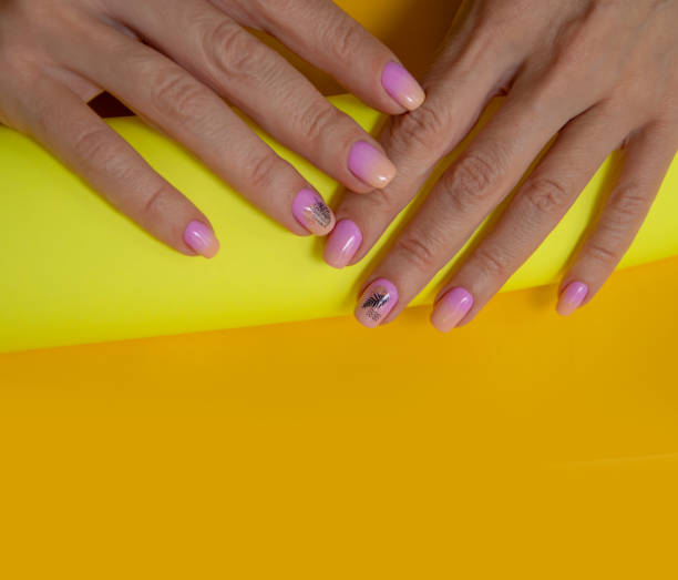 istock Female hand beautiful manicure on a colored background 1488216186