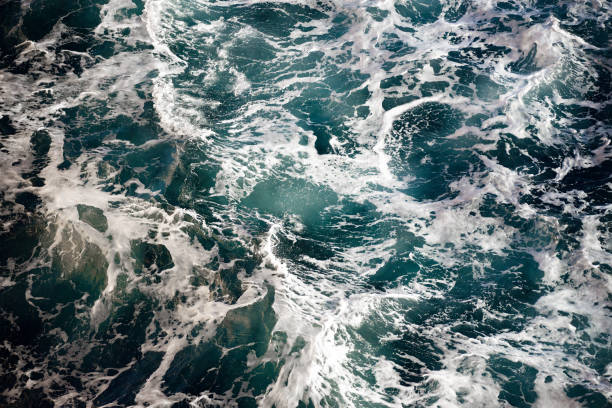 istock Blue waves, white sea foam background 1488216190