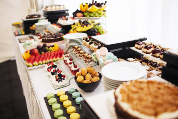 istock Wedding cake table background. Sweet and delicious restaurant desserts. Catering table. Bakery and pastry background. 1488216587