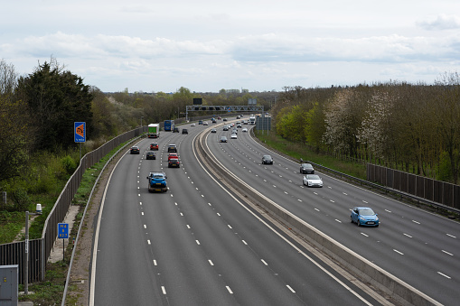 Late afternoon traffic on curving sections of the M8 and M77 motorways in Glasgow's Southside.
