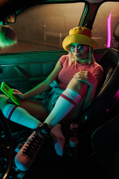 istock Stylish retro girl in car. 1488224855