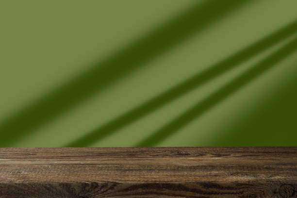 istock Empty wood table for product mock up and green background 1488226417