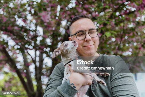 istock Portrait of adult man with Autism and his Dog 1488226579
