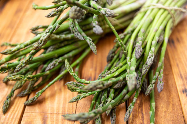 istock Bunch of raw asparagus spears, close up 1488228992