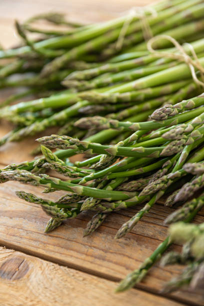 istock Bunch of raw asparagus spears, close up 1488229573