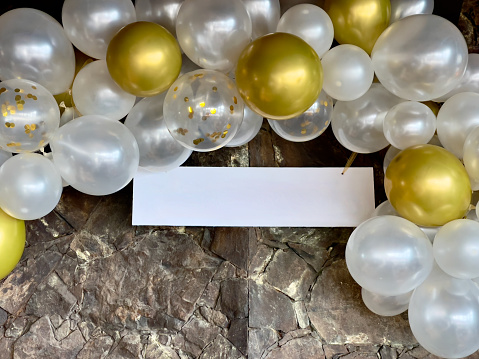 White and Gold Balloons with blank sign for copy space background