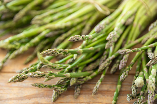 istock Bunch of raw asparagus spears, close up 1488230569