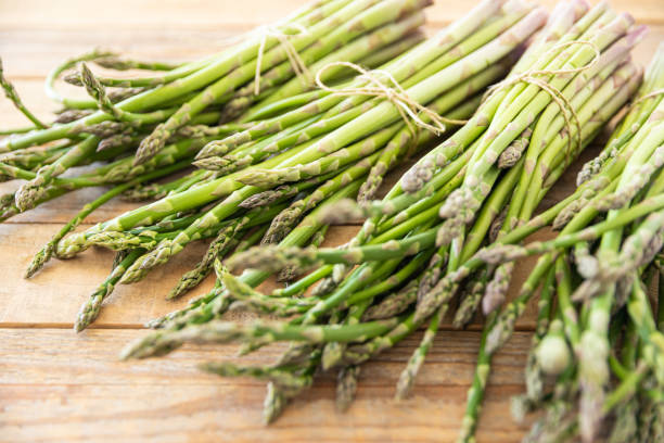 istock Bunch of raw asparagus spears, close up 1488230575