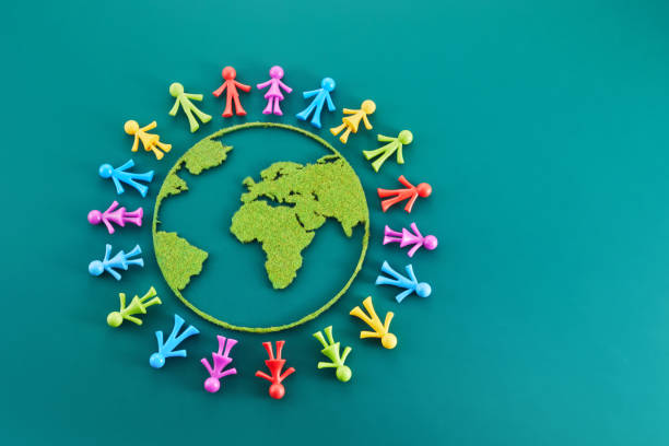 istock People from all around world standing on globe, 1488232919