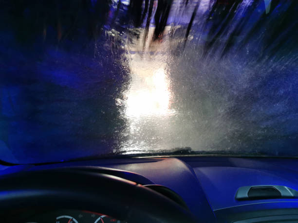 istock Car Care Business. Automatic Car Wash Process. Spray foam bubble shampoo on the car surface. Inside view 1488234158