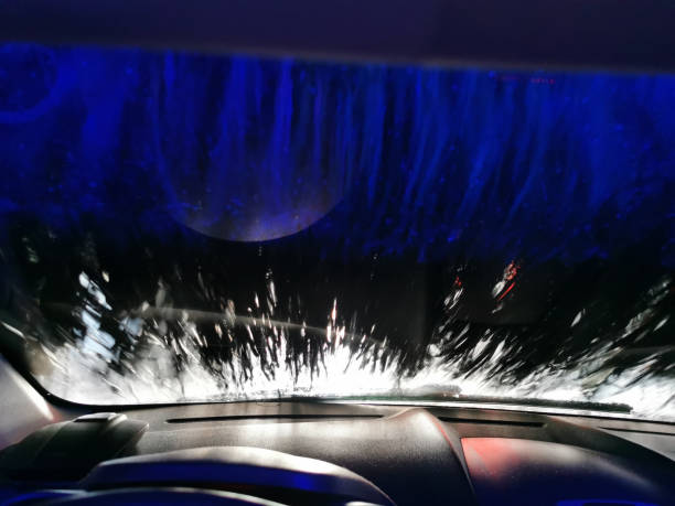 istock Car Care Business. Automatic Car Wash Process. Spray foam bubble shampoo on the car surface. Inside view 1488234178