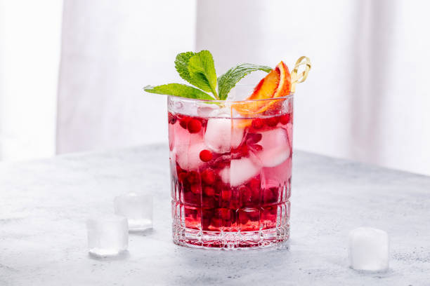 istock Cold refreshing summer drink with lingonberry and oranges 1488236902