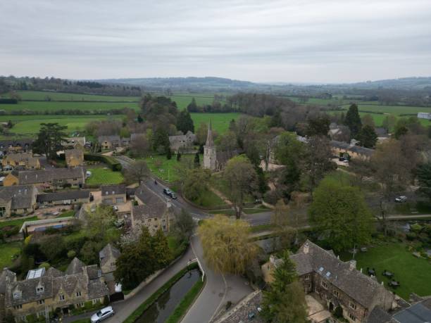 istock Lower Slaughter quaint Cotswolds village England  high angle drone, aerial 1488237492