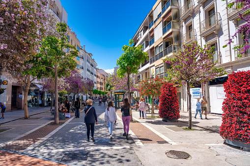 Estepona, Spain - April 7, 2023: The beautiful promenade of Estepona on a clear sunny day, Andalusia.