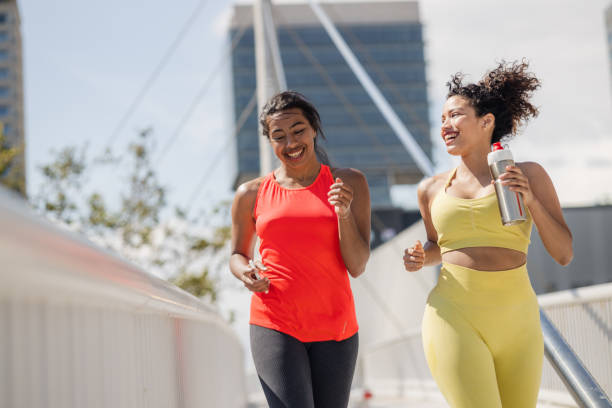 istock Two young women jogging outdoors 1488238891