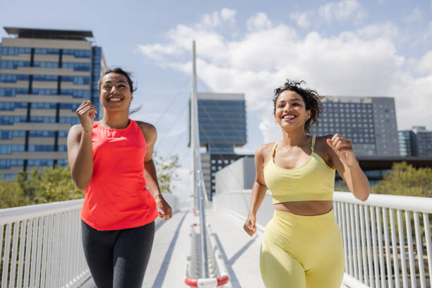 istock Female athletes running on a beautiful spring day 1488238925