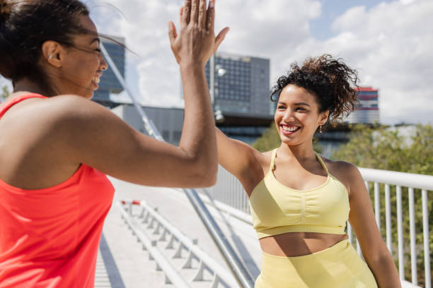 istock Cheerful women giving each other high five after running 1488238927
