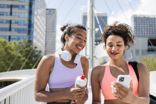 istock Two cheerful friends coming back from the gym 1488238975