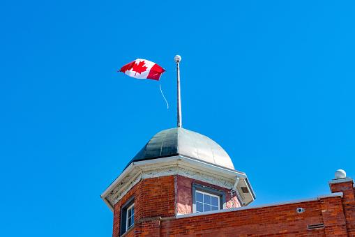 Canadian flag flying in the wind along the Icefields Parkway, Banff